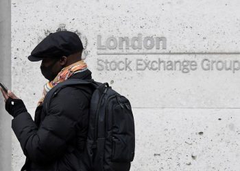 Stocks hit records again; bitcoin surges after Tesla move