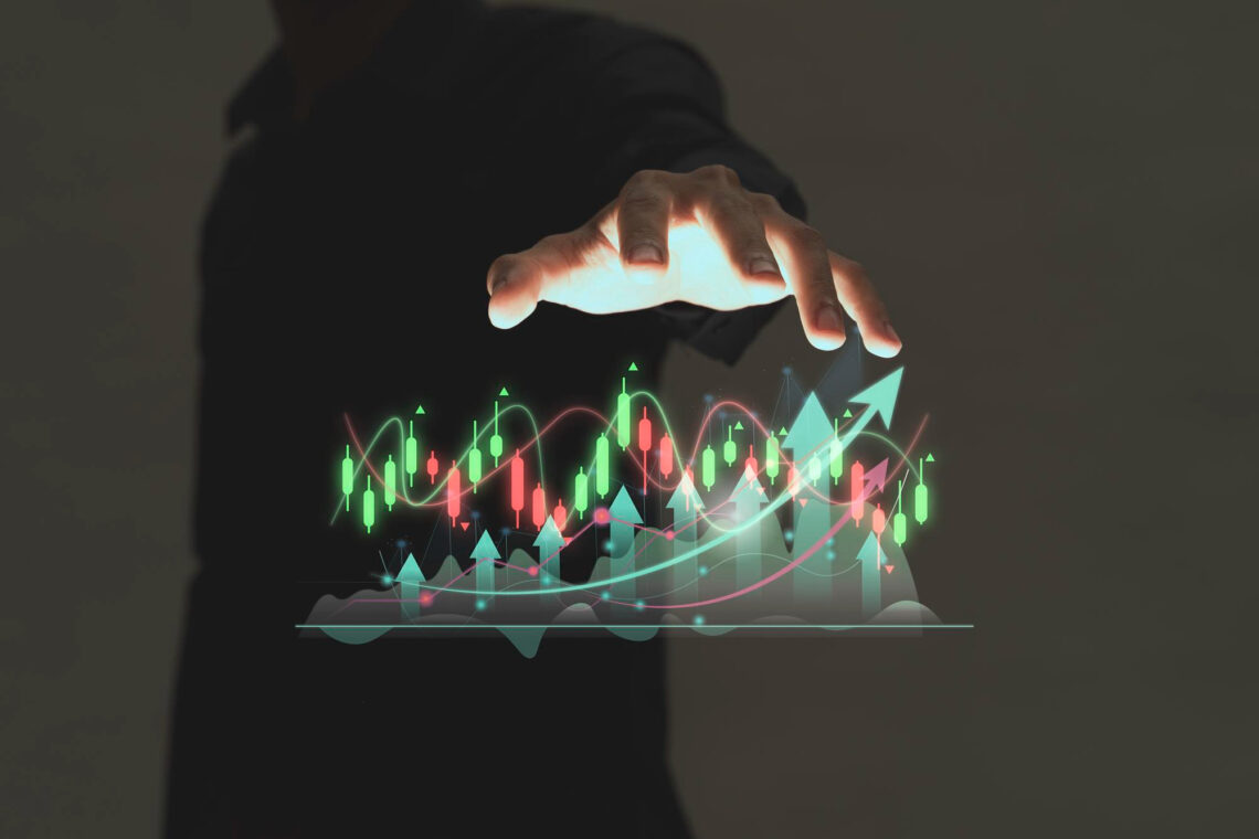 A person’s hand hovers over a glowing digital chart showing candlestick patterns, lines, and upward arrows, symbolizing financial growth, smart investing strategies, and stock market analysis on a dark background. | ZIIMP