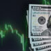 A stack of 100-dollar bills lies in the lower right corner beside a digital screen showing a green, declining stock market graph on a dark background, highlighting the potential benefits of Dollar-Cost Averaging during downturns. | ZIIMP